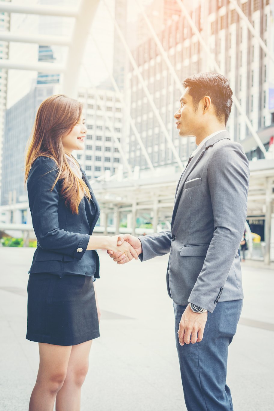 Business partnership discussion in a modern Singapore setting